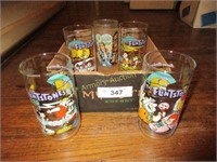 4 Flintstone glasses and 1 star wars glass