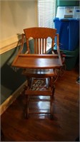 Antique oak rolling highchair