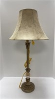 Beautiful metal lamp with intricate glass piece