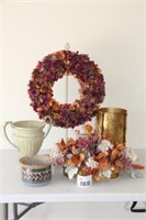 floral wreath, urns, brass planter with flowers