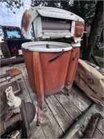 antique washer “Speed Queen” on casters.