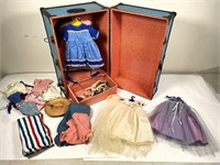 Doll clothes in doll ward robe- good condition