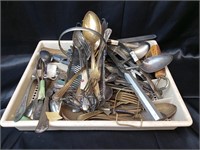 Assorted antique dinner utensils.
Some are