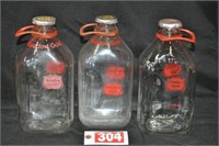 (3) Meadow Gold 1/2-gal. glass milk jugs
