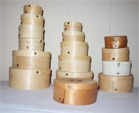 lot of small wooden nesting cheese boxes