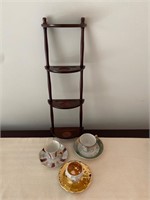 Cups and saucers with shelf