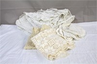 Handcrafted doilies, large tablecloth, table