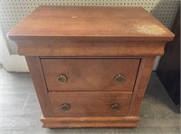 Wooden nightstand or end table with two drawers.