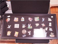 A case with 27 Disney pins