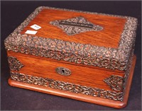 An oak jewelry box with silverplate trim,
