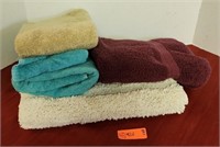 Assorted bathroom hand towels and bath mat