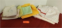 Assorted kitchen cloths, table runners and apron