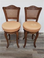 Pair of vintage swivel walnut barstools