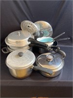 Assorted pots and pans including enamelware,