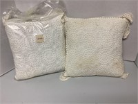 2 crocherted covered pillows 1 needs cleaned
