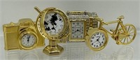 4 Miniature brass clocks