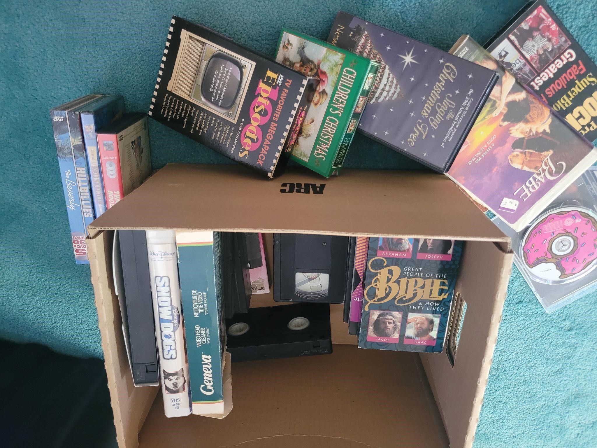 Lot of vhs and dvds and misc