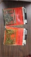 Box full of plastic anchors new in packages