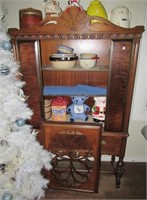 Antique wood cabinet with single drawer and door.