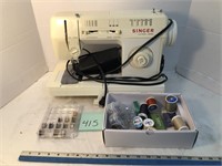 Singer sewing machine w/accessories/supplies