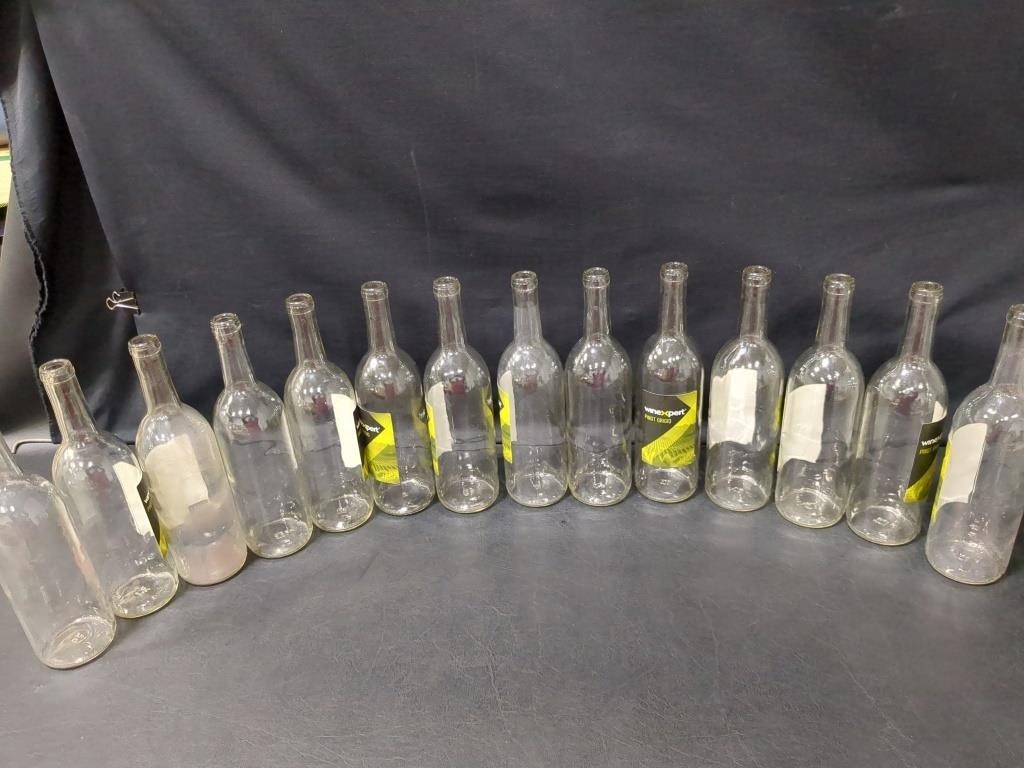 14 clear wine bottles