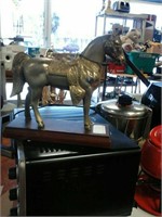 Metal horse on stand