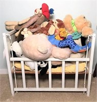 Selection of Plush Animals in Doll Basinet