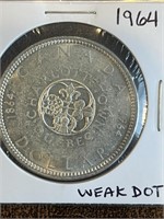 Canada 1964 Silver Dollar.  Weak Dot.