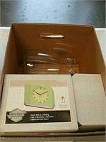 Box of clocks and glass pitcher