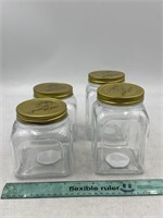 NEW Lot of 4- Glass Jars W/ Lids