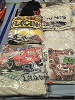 Lot of racing t-shirts and flags