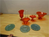 Orange Viking glass vase, blue glass plates.