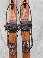 Vintage Wooden skis with cable style binding.