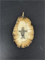 Walrus ivory, intricately scrimmed pendant.