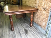 Solid dark oak dining table has no center leaf and