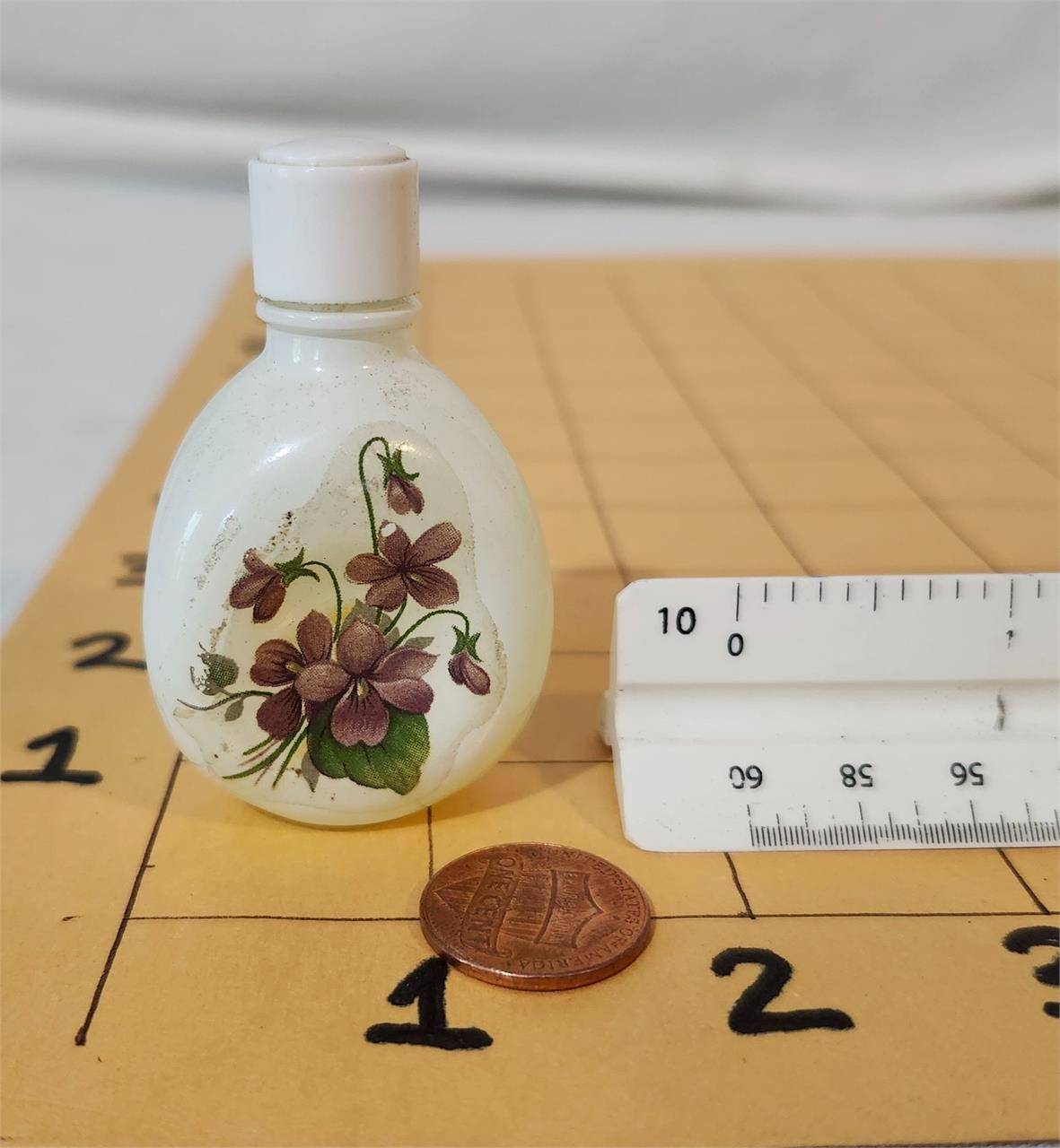Perfume in antique mini milk glass bottle
