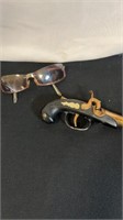 Gun lighter and vintage glasses
