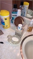 Loose items  on bathroom sink personal toiletries