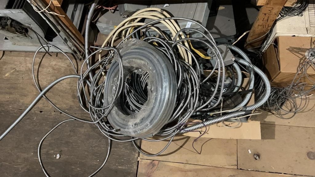 Assorted metal conduit wires and electrical boxes