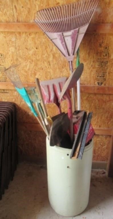 Contents of plastic bin that includes rake,