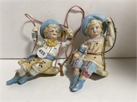 2 Ceramic Figures on Swings