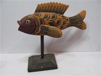 Wooden fish on stand
