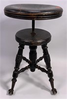 Oak piano stool, iron claw and glass ball feet,