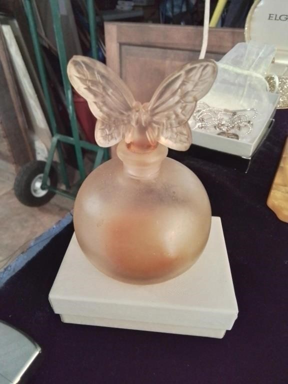 Vintage perfume bottle with glass butterflies