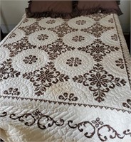 Quilt, brown needlework accent