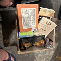 BOX IF BOOKS AND BRONZE SHOES
