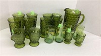 Green glass pitcher with matching cups. 16 cups