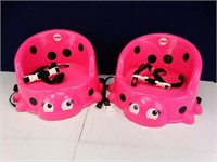 (2) pink portable booster seats