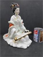 Geisha en porcelaine