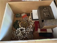 Box of jewelry, Bibles and tissue cover